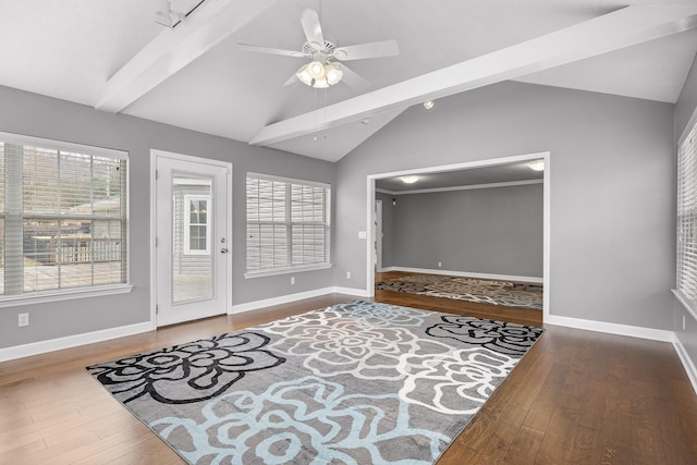 interior space featuring vaulted ceiling with beams, ceiling fan, and hardwood / wood-style flooring