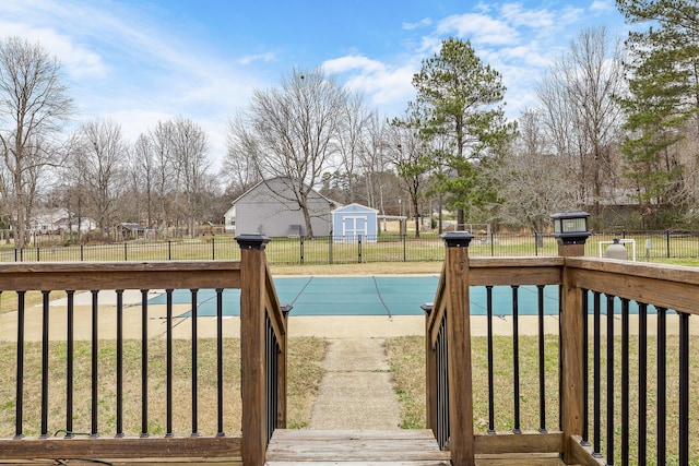 view of swimming pool with a lawn