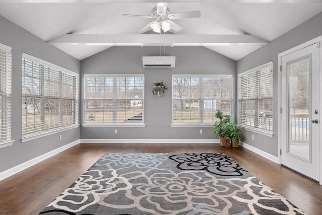 sunroom / solarium with ceiling fan, lofted ceiling with beams, a wealth of natural light, and a wall unit AC