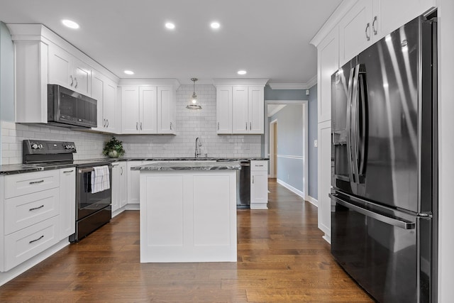 kitchen featuring dark hardwood / wood-style flooring, decorative light fixtures, white cabinets, stainless steel fridge with ice dispenser, and black / electric stove