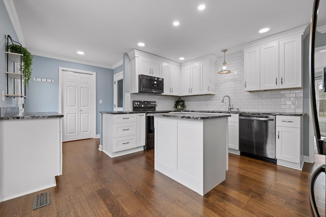 kitchen featuring white cabinetry, range with electric cooktop, stainless steel dishwasher, and decorative light fixtures