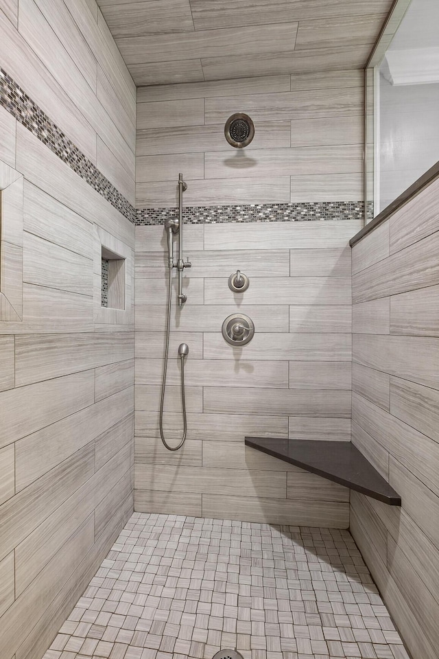 bathroom featuring tiled shower