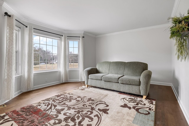 living room with light hardwood / wood-style floors and crown molding