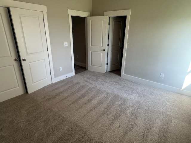 unfurnished bedroom featuring carpet