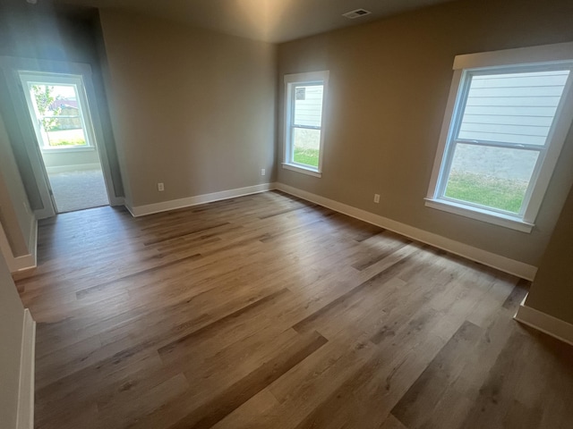 unfurnished room with light hardwood / wood-style flooring