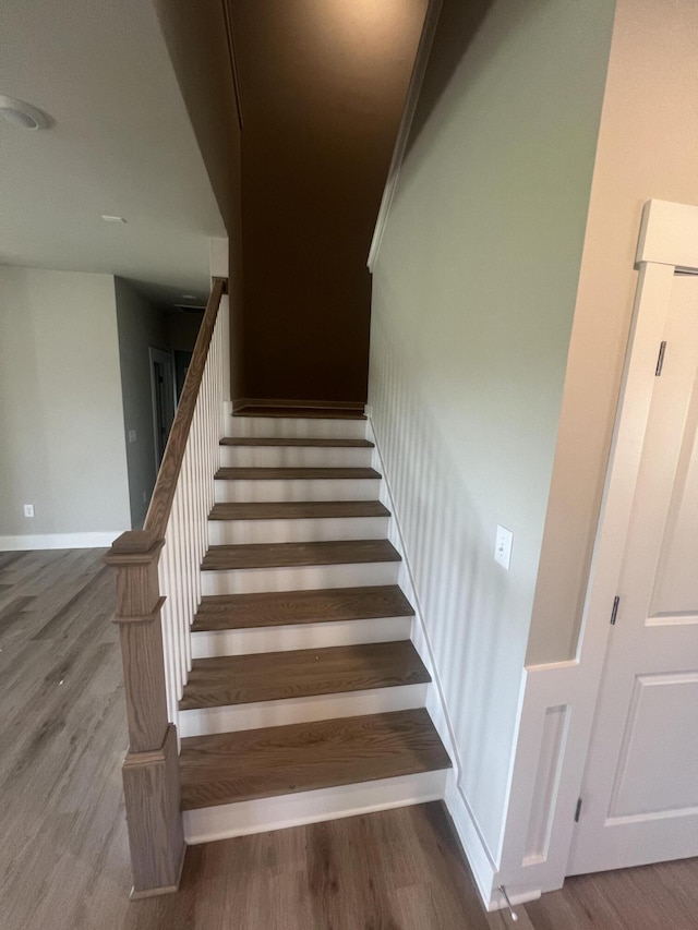 stairway featuring hardwood / wood-style floors