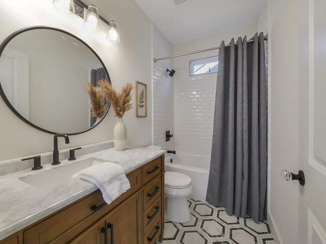 full bathroom with shower / tub combo, vanity, and toilet