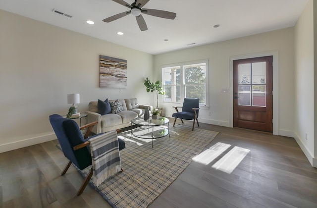 living room with hardwood / wood-style floors and ceiling fan