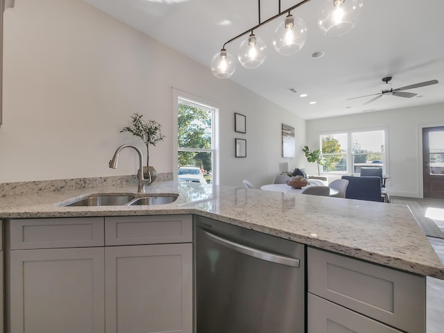 kitchen featuring ceiling fan, stainless steel dishwasher, plenty of natural light, and sink