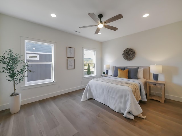 bedroom with ceiling fan and hardwood / wood-style floors