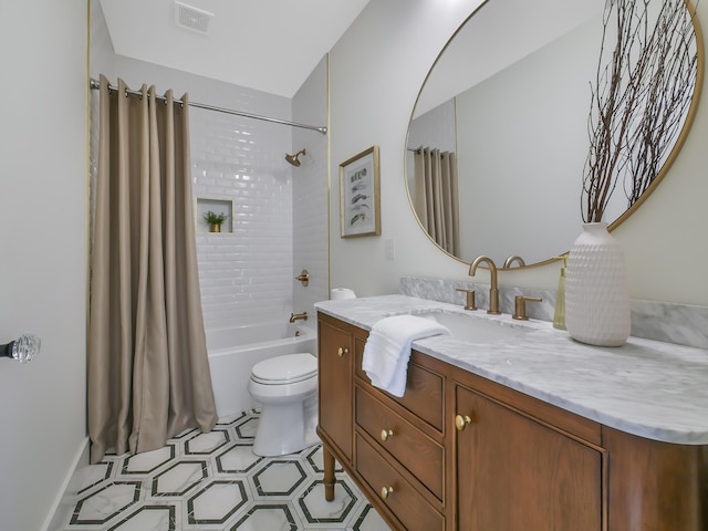 full bathroom with shower / bath combo, vanity, and toilet