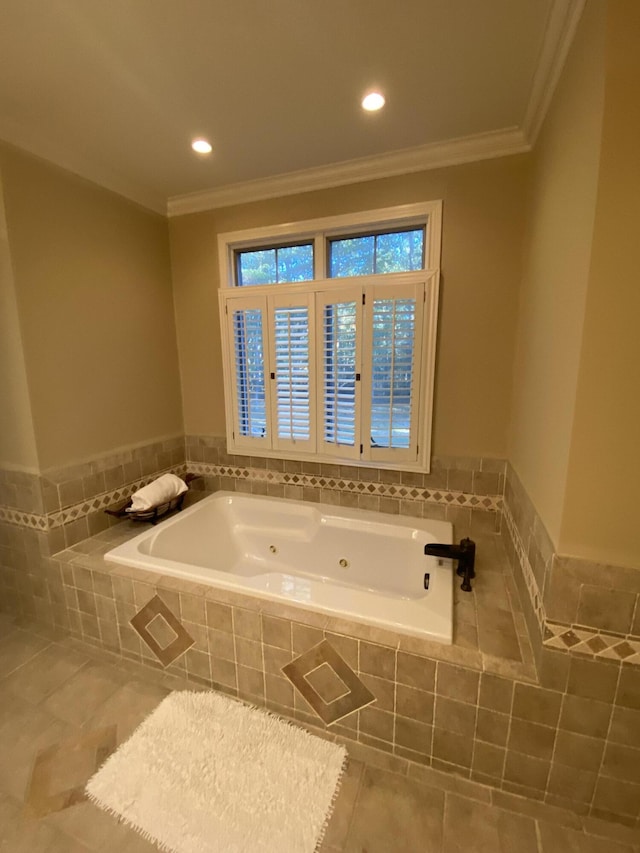 bathroom with tile patterned floors, a relaxing tiled tub, and crown molding