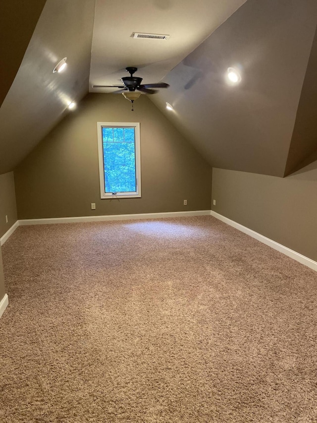 additional living space with carpet, ceiling fan, and lofted ceiling