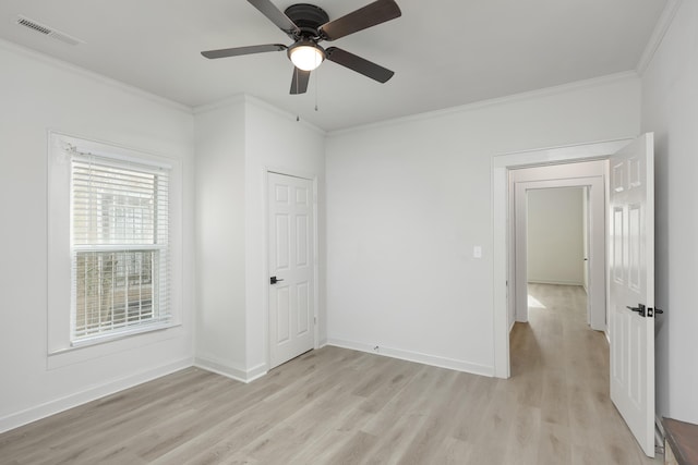 interior space with light hardwood / wood-style floors, ceiling fan, and crown molding