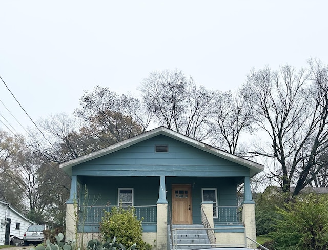 bungalow-style home with a porch