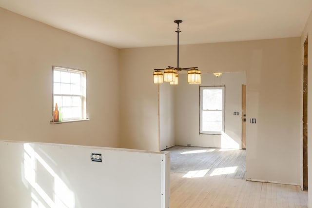 spare room featuring light hardwood / wood-style floors