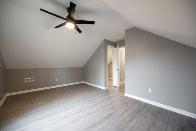 bonus room featuring wood-type flooring, lofted ceiling, and ceiling fan