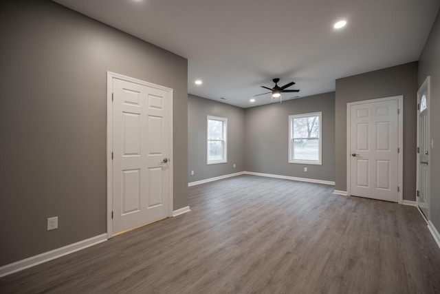 spare room featuring hardwood / wood-style flooring and ceiling fan