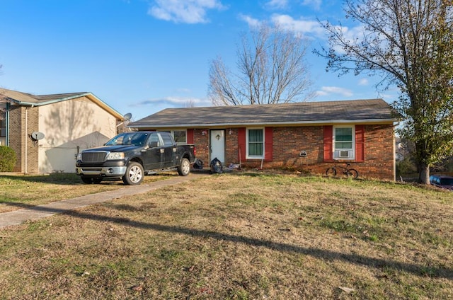 ranch-style house with cooling unit and a front yard