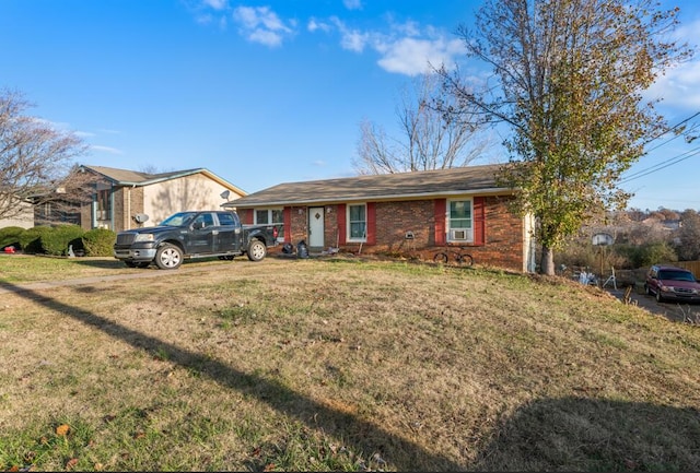 single story home with a front yard