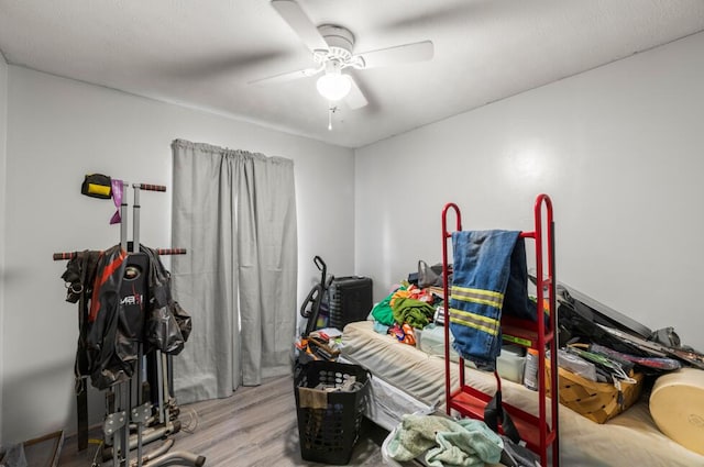 interior space with ceiling fan and light hardwood / wood-style floors