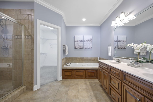 bathroom with tile patterned flooring, shower with separate bathtub, vanity, and ornamental molding