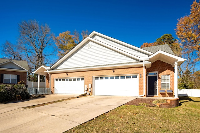 view of front of house with a front yard and a garage