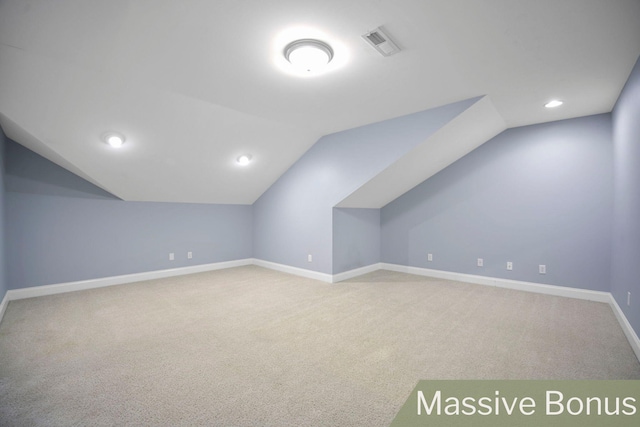 bonus room featuring carpet and vaulted ceiling