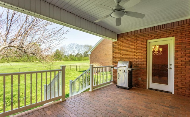 view of patio with ceiling fan and a grill