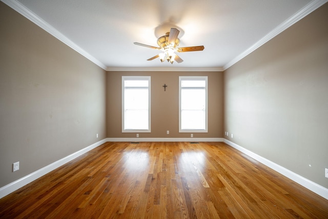 unfurnished room featuring ceiling fan, light hardwood / wood-style floors, and crown molding