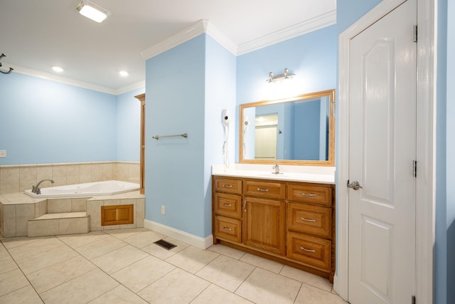 bathroom featuring tile patterned floors, vanity, crown molding, and tiled tub