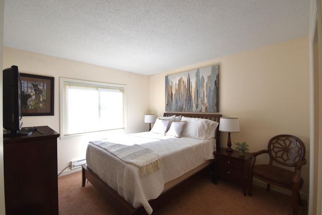 carpeted bedroom with a textured ceiling