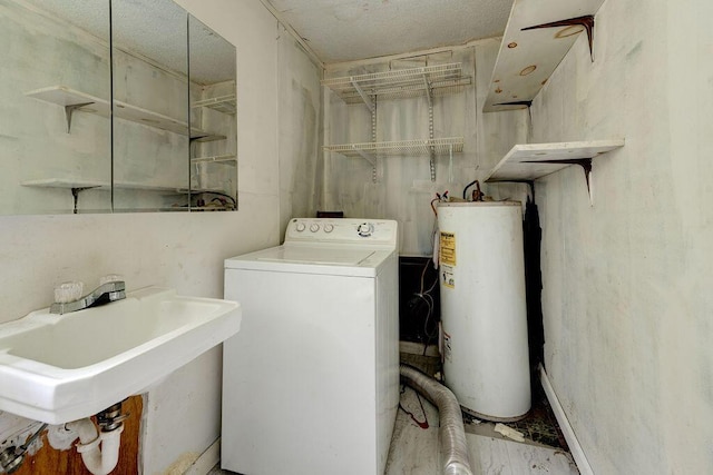 laundry area with water heater, sink, and washer / dryer