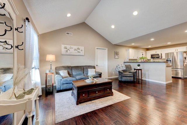 living room featuring vaulted ceiling and dark wood-type flooring