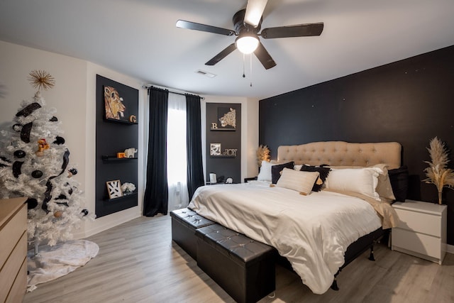 bedroom featuring ceiling fan and light hardwood / wood-style flooring