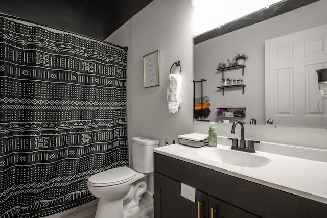 bathroom with hardwood / wood-style floors, vanity, toilet, and a shower with shower curtain