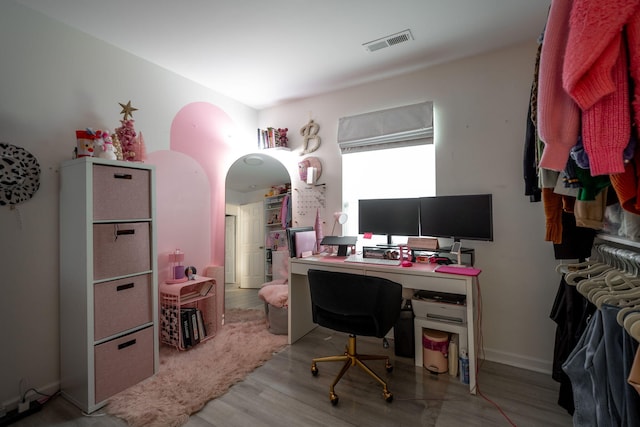 office with light hardwood / wood-style flooring