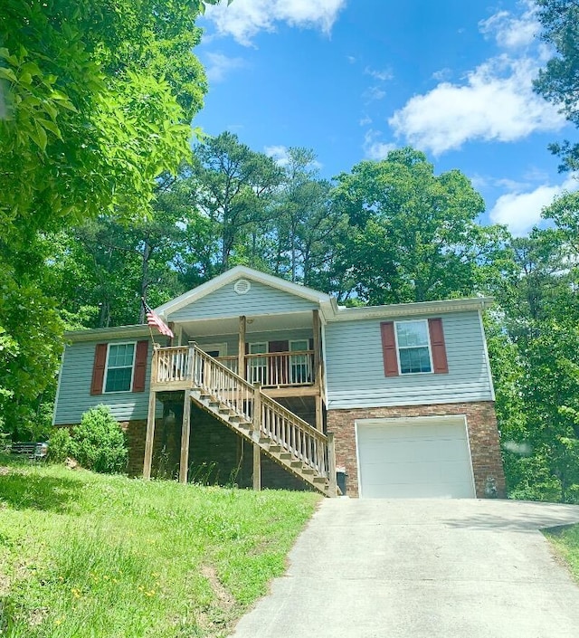 view of front of home with a garage and covered porch