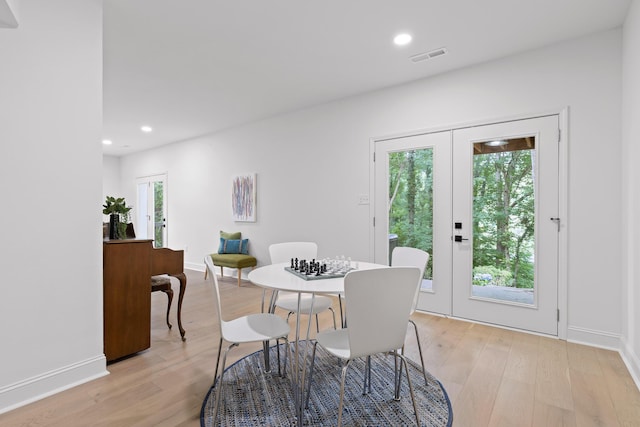 dining space featuring visible vents, recessed lighting, french doors, and light wood-type flooring