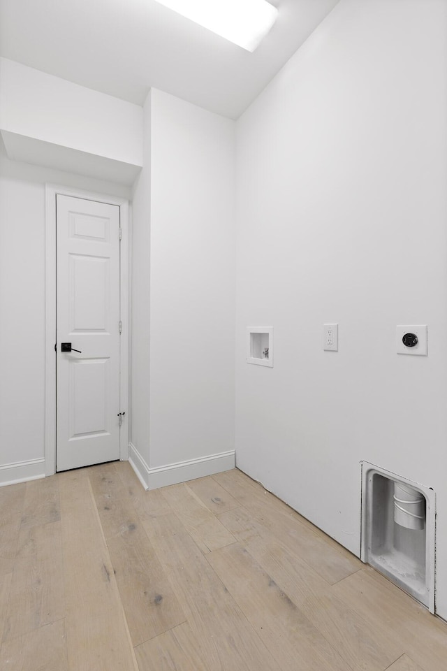 laundry area with hookup for a washing machine, light wood-style flooring, hookup for an electric dryer, and laundry area