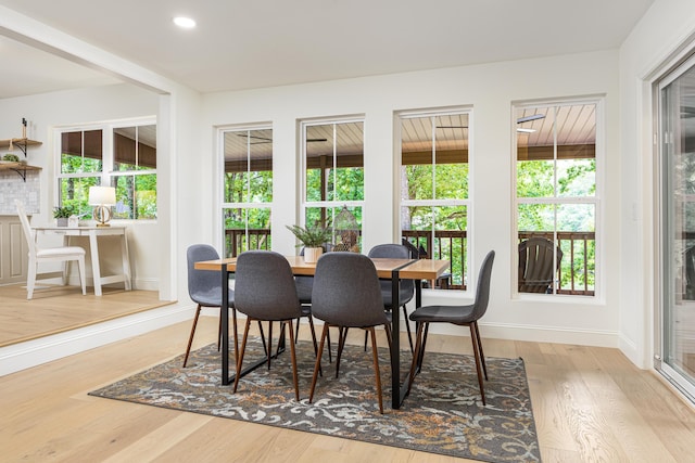 dining room featuring recessed lighting, wood finished floors, and baseboards