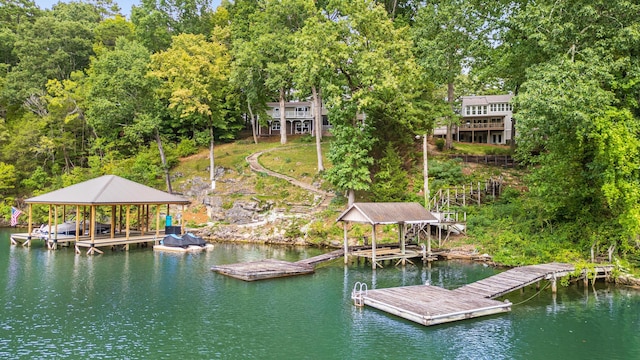 view of dock featuring a water view and boat lift