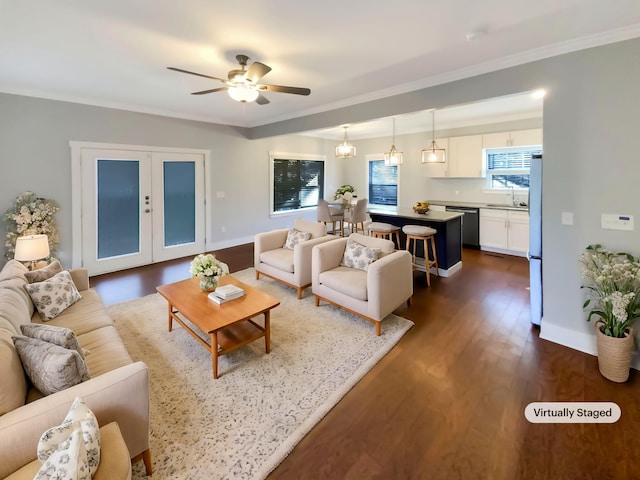 living room with ceiling fan, french doors, sink, dark hardwood / wood-style flooring, and crown molding