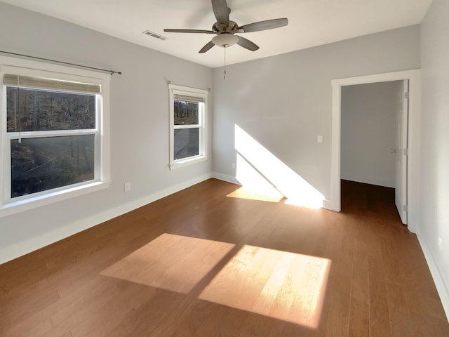 unfurnished room featuring hardwood / wood-style flooring and ceiling fan