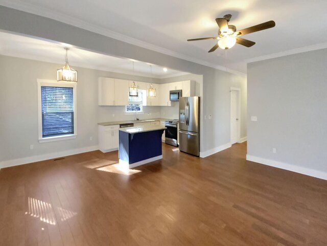 9693 W Ridge Trail Rd, Soddy Daisy, TN 37379 - kitchen featuring stainless steel appliances, dark wood-style floors, white cabinets, a center island, and light countertops