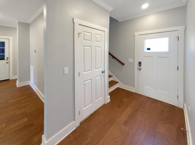 foyer with wood-type flooring and ornamental molding