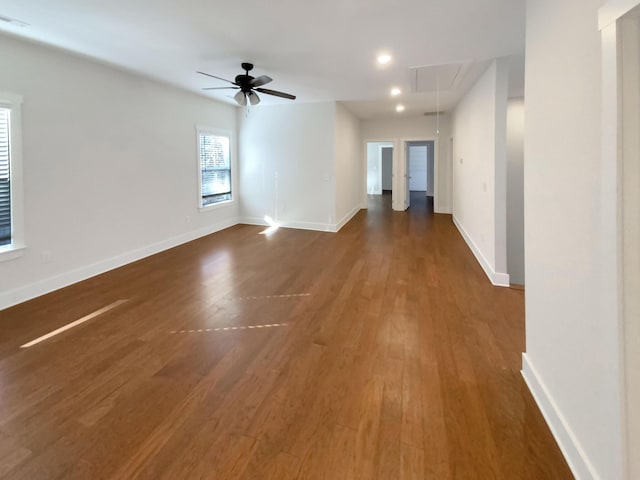 spare room featuring ceiling fan and dark hardwood / wood-style flooring