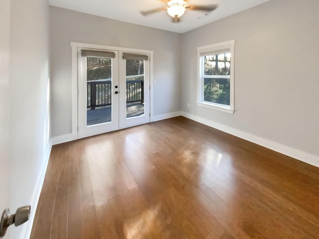 unfurnished room with hardwood / wood-style floors, ceiling fan, and french doors