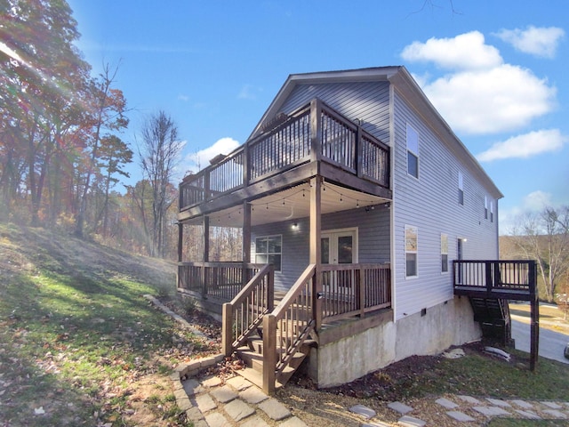 exterior space with a front yard and a deck