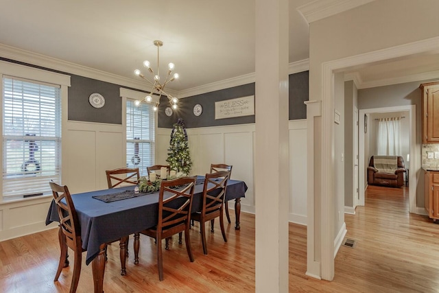 425 Wildewood Trl, Chickamauga, GA 30707 - dining room with a wealth of natural light, light wood-style floors, a notable chandelier, and visible vents